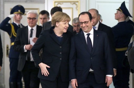 Grund zur Zufriedenheit: Kanzlerin Angela Merkel und Frankreichs Präsident François Hollande beim Vierergripfel in Minsk. Foto: dpa