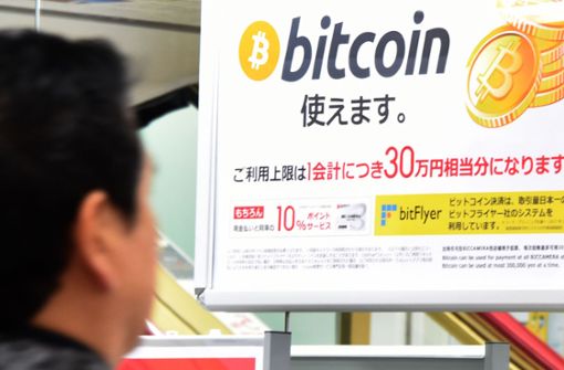 In Asien sind Bitcoin und Co. sehr beliebt – hier ein Bild aus Tokio. Foto: AFP