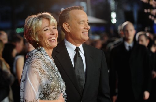 Den Regen einfach weglächeln: Tom Hanks und Emma Thompson bei der Weltpremiere von Saving Mr. Banks in London. Foto: Getty Images Europe