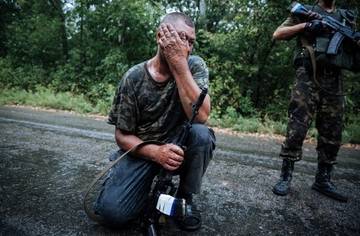 Erschöpte ukrainische Soldaten bei Gorlovka. Foto: EPA