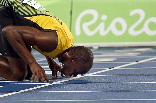 Usain Bolt feiert sein Gold über 200 Meter. Foto: EPA