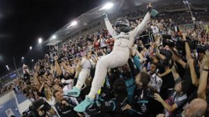 Nico Rosberg feiert in Abu Dhabi seinen Weltmeistertitel. Foto: dpa