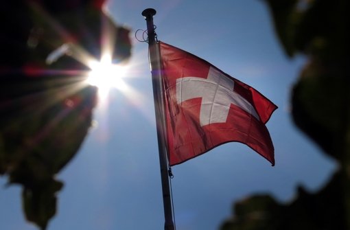 In der Schweiz und in Deutschland geht die Meinung in Sachen Steuerfragen auseinander. Foto: dpa