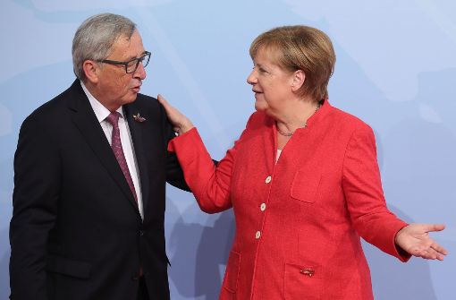 Zwei, die sich gut verstehen: Jean-Claude Juncker und Angela Merkel. Foto: dpa