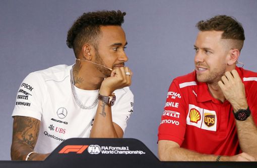 Starke Frisuren, starke Jungs: Lewis Hamilton (links) und Sebastian Vettel bringen es gemeinsam auf stattliche neun WM-Titel. Foto: AP