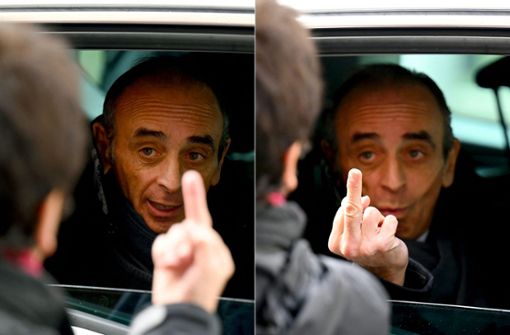 Wie du mir, so ich dir: Der französische Präsidentschaftskandidat Eric Zemmour reagiert auf den Mittelfinger einer Passantin mit derselben Geste. Foto: AFP/Nicolas Tucat