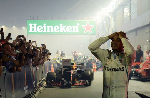 Lewis Hamilton feierte bei dem Formel-1-Rennen in Singapur seinen siebten Saisonsieg. Foto: AFP