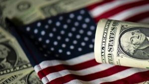 Dollarnote auf amerikanischer Flagge Foto: dpa