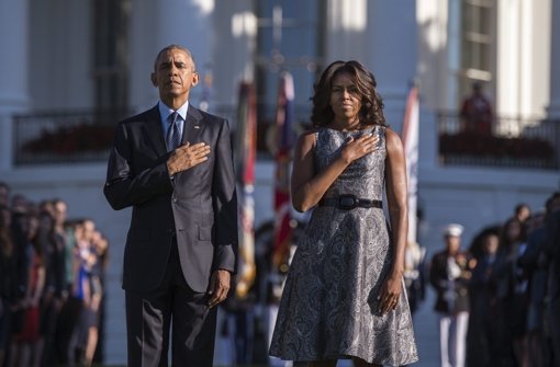US-Präsident Barack Obama und seine Frau Michelle bei der Gedenkminute für die Opfer des 11. September. Foto: dpa
