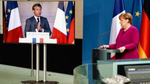 Eine gemeinsame Pressekonferenz in Corona-Zeiten: Angela Merkel und Emmanuel Macron haben am Montagabend von Berlin und Paris aus zusammen über ihre Initiative informiert. Foto: AFP/Kay Nietfeld