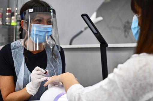 Körpernahe Dienstleister dürfen in Stuttgart am Donnerstag wieder öffnen – unter Hygieneregeln wie einer Maskenpflicht. Foto: AFP