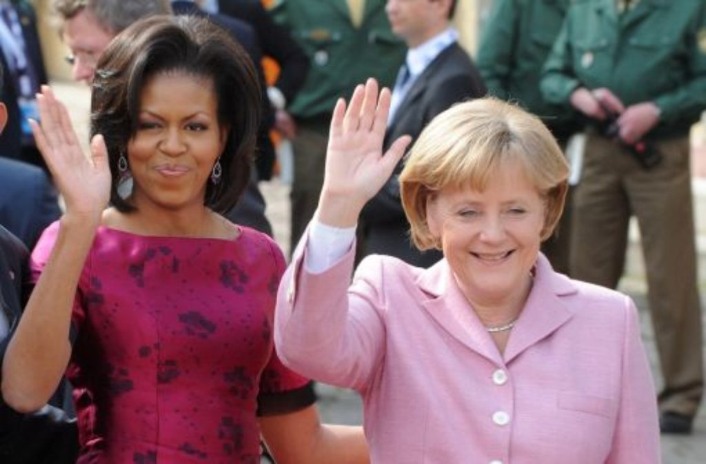 Platz 1: Bundeskanzlerin Angela Merkel (rechts) ist die mächtigste Frau der Welt - und verweist US-First-Lady Michelle Obama auf den achten Platz der Forbes-Liste.