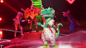 Der Dinosaurier gewinnt die vierte Staffel von „The Masked Singer“. Foto: dpa/Willi Weber