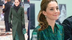 Wegen des schlechten Wetters trug Herzogin Kate über ihrem Pfauen-Kleid einen tannengrünen Mantel. Foto: Getty Images