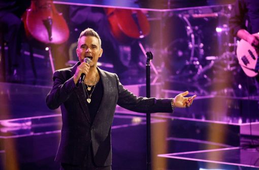 Der britische Popstar Robbie Williams – hier beim Auftritt in der ZDF-Show „Wetten, dass..?“ – hat die englische Nationalmannschaft in Katar besucht. Foto: dpa/Philipp von Ditfurth
