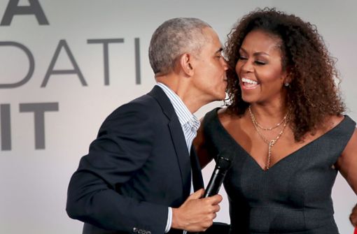 Michelle und Barack Obama: eingespieltes Team, jetzt auch in der  Podcast-Version Foto: AFP/  Olson