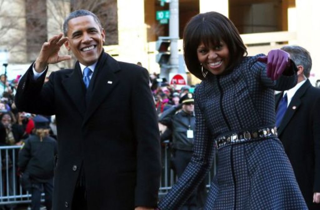 Triumphzug durch Washingtons Straßen: US-Präsident Barack Obama (mit seiner Frau Michelle) hat am Montag bei einer feierlichen Zeremonie erneut seinen Amtseid abgelegt.