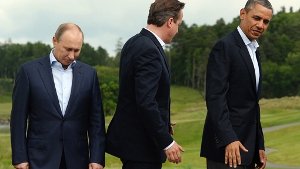 Barack Obama (rechts) und David Cameron (Mitte) wollen gegenüber Wladimir Putin Härte zeigen. Foto: EPA