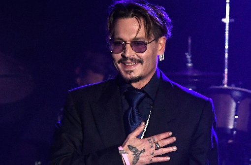Johnny Depp ist nach dem Konzert und der Auszeichnung zu seinen Ehren ganz gerührt. Foto: AFP