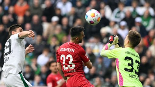 Sargis Adamyan (M) und der 1. FC Köln nehmen einen Punkt aus Mönchengladbach mit. Foto: Federico Gambarini/dpa