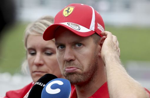 Sebastian Vettel glaubt noch an seine Chance – sagt er zumindest. Foto: AP