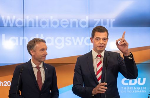 CDU-Landesgeneralsekretär Raymond Walk (links, mit Spitzenkandidat Mike Mohring) schließt eine Zusammenarbeit mit den Flügeln aus. Foto: AFP/MICHAEL REICHEL