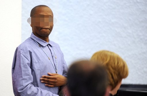 Der mutmaßliche afrikanische Kriegsverbrecher Ignace Murwanashyaka  im Oberlandesgericht in Stuttgart. Foto: dpa