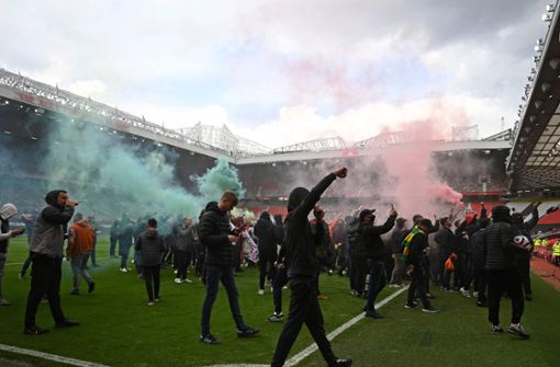 Die Fans von Manchester United stürmten das Stadion. Foto: AFP/OLI SCARFF