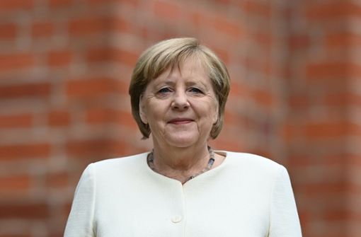 Angela Merkel stellt sich Fragen eines Journalisten. Foto: dpa/Hendrik Schmidt