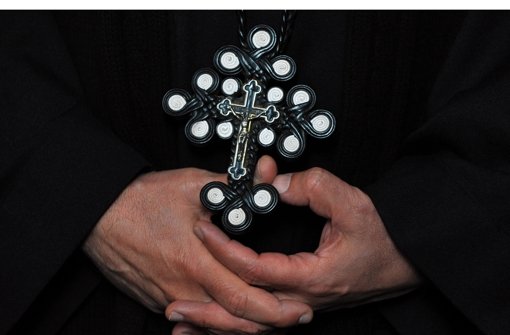 Ein koptisches Kreuz hat an jedem Arm drei Kreise, die für die Dreifaltigkeit stehen. Die zwölf äußeren Kreise symbolisieren die zwölf Apostel, die vier inneren stehen für die vier Evangelisten Foto: dpa
