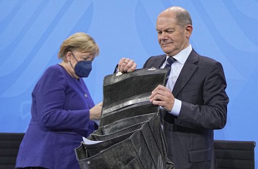 Angela Merkel und Olaf Scholz nehmen an der Runde teil. Foto: dpa/Michael Kappeler