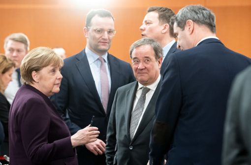 Angela Merkel und die Ministerpräsidenten: Wer entscheidet was? Foto: dpa/Bernd von Jutrczenka