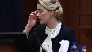 Amber Heard weint vor Gericht. Foto: AFP/JIM LO SCALZO / POOL