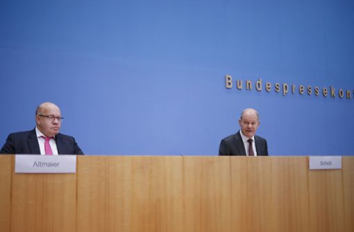 Peter Altmaier und Olaf Scholz bei der Pressekonferenz zu den neuen Corona-Hilfen. Foto: dpa/Markus Schreiber