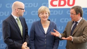 Bundeskanzlerin Angela Merkel  mit Generalsekretär Peter Tauber (links) und dem Chef der nordrhein-westfälischen CDU, Armin Laschet. Foto: dpa