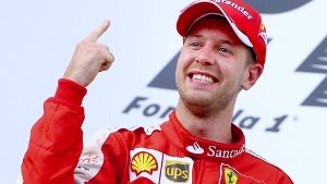 Der sichtlich gerührte Sebastian Vettel ist nach seinem Sieg mit Ferrari beim Großen Preis von Malaysia im Freudentaumel. Foto: EPA