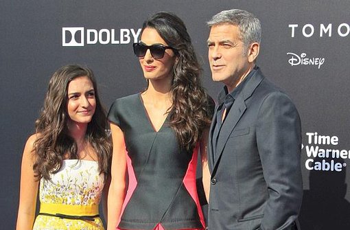 Die Clooneys bei der Filmpremiere von Tomorrowland. Foto: dpa