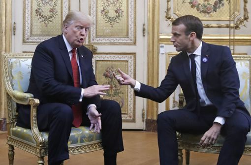 US-Präsident Donald Trump und Emmanuel Macron versuchen, sich zu einigen. Foto: AP
