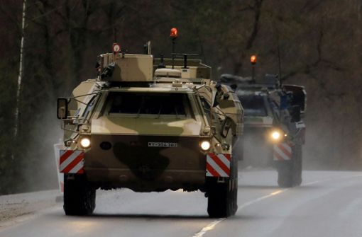 Bundeswehr-Fahrzeuge bei ihrer Ankunft in Litauen Foto: AFP/PETRAS MALUKAS
