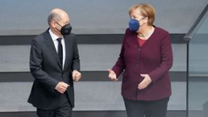 Olaf Scholz und Angela Merkel haben sich mit den Ministerpräsidenten auf Maßnahmen zum Brechen der vierten Coronawelle verständigt. Foto: dpa/Kay Nietfeld