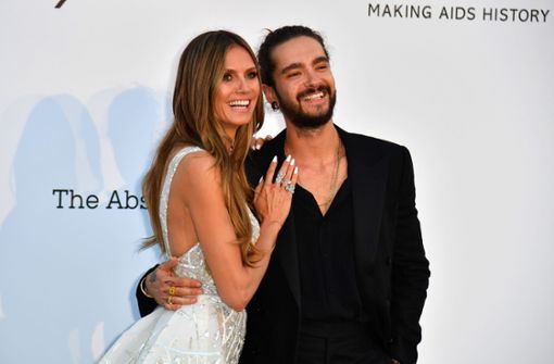 Heidi Klum und Tom Kaulitz ganz verliebt auf dem roten Teppich in Cannes. Foto: AFP